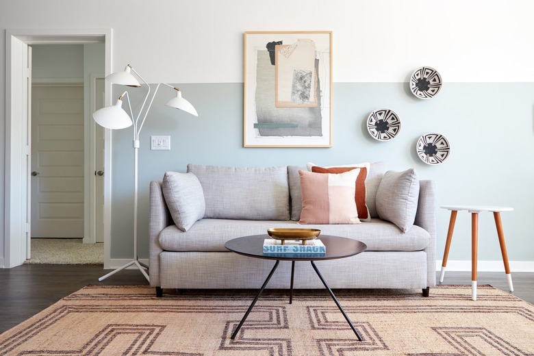 Eclectic living room with gray couch